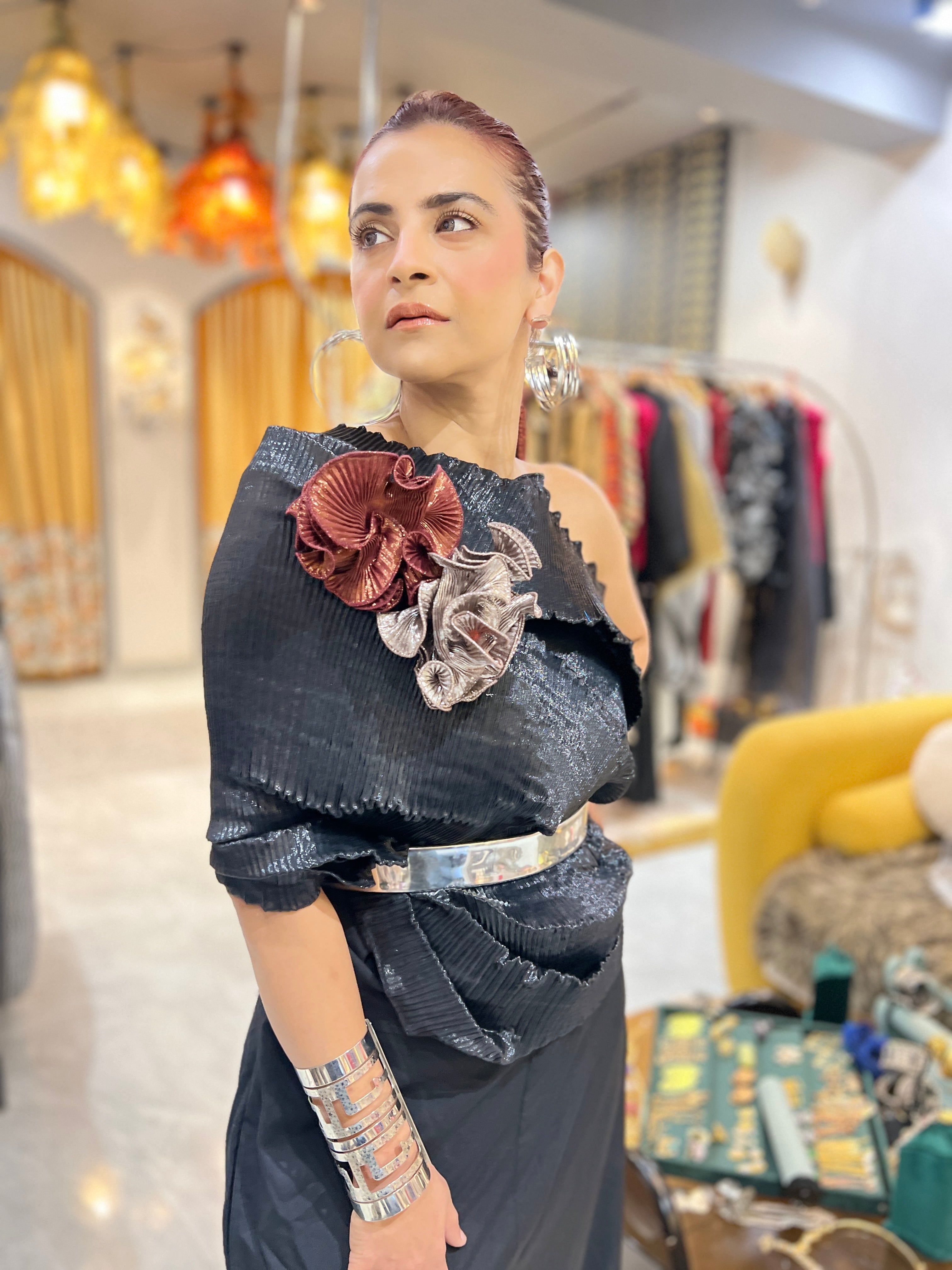 Black multidrape jumpsuit with silver belt