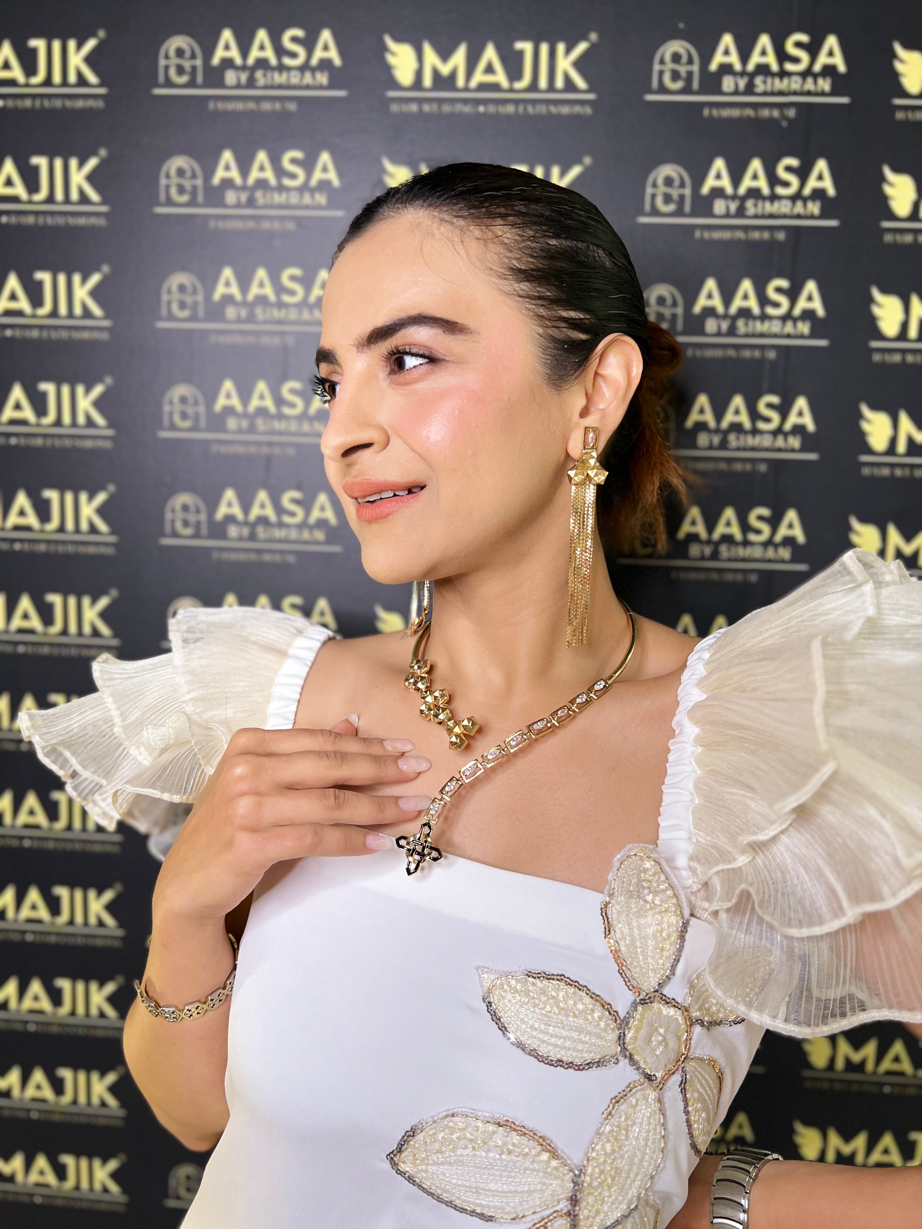 Ivory tube embroidered ruffle top