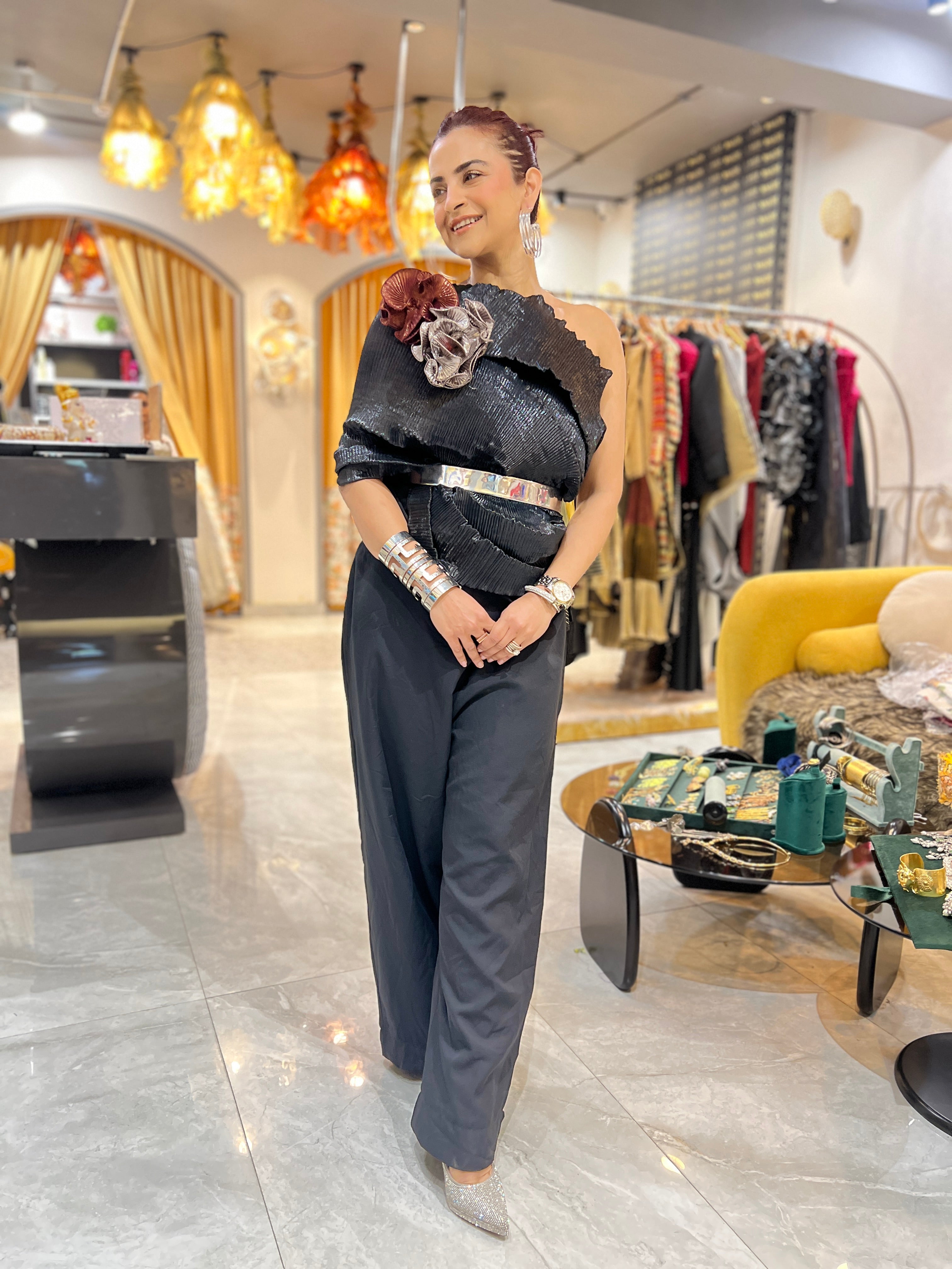 Black multidrape jumpsuit with silver belt