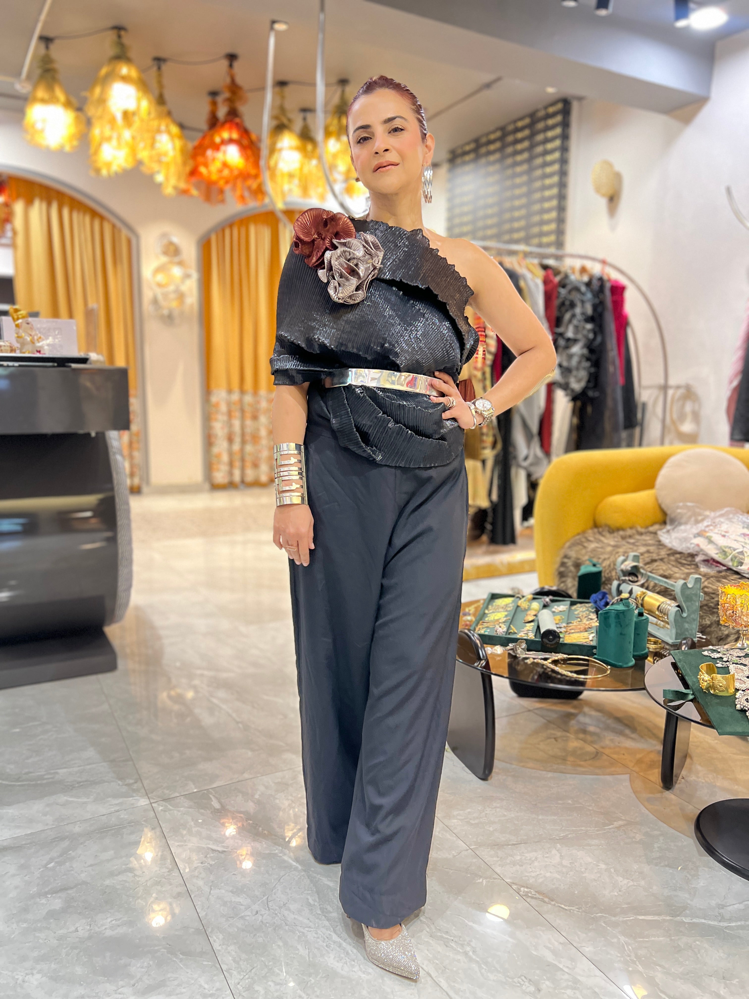 Black multidrape jumpsuit with silver belt