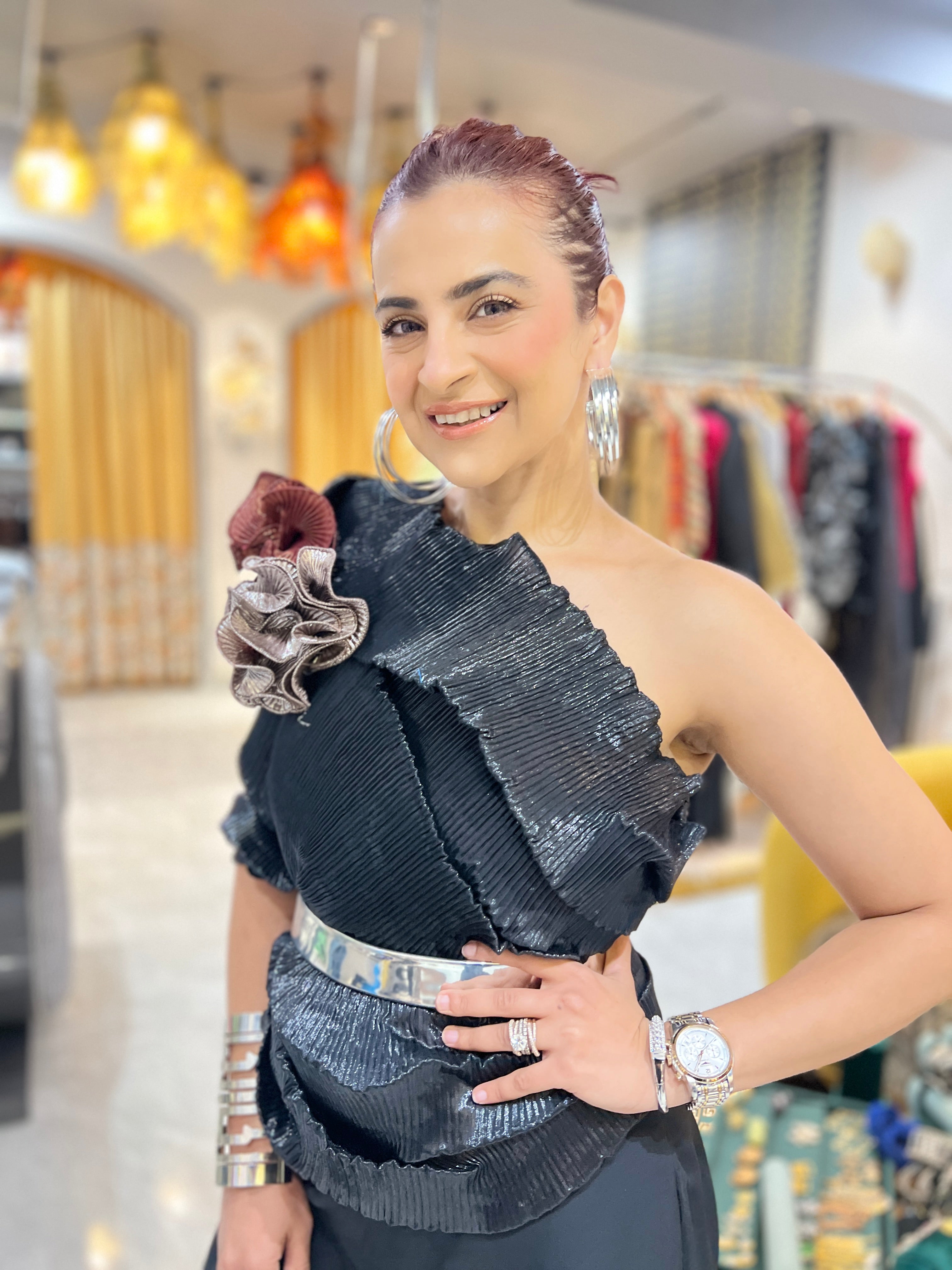 Black multidrape jumpsuit with silver belt