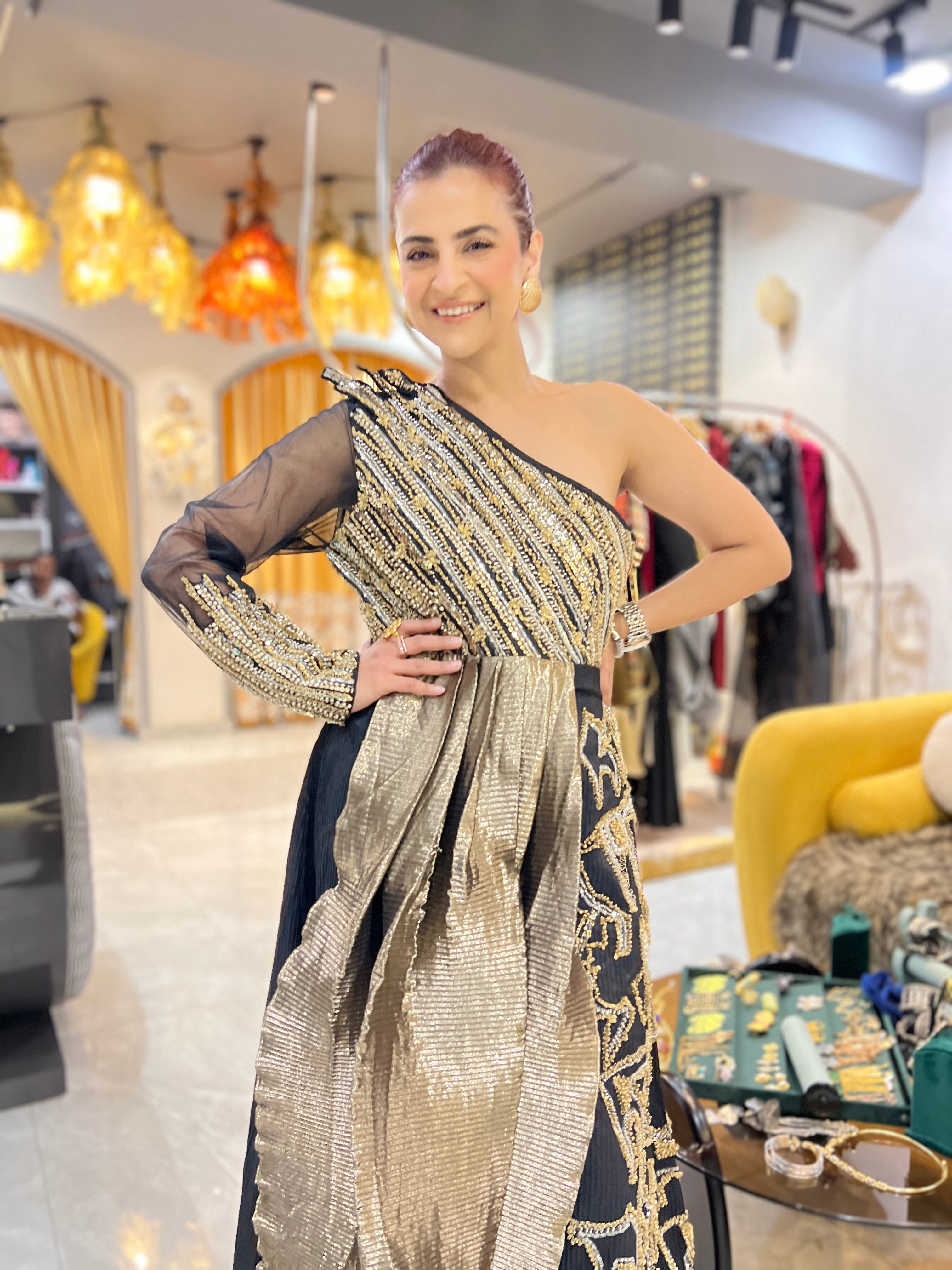 Off shoulder black embroidered gown with earrings