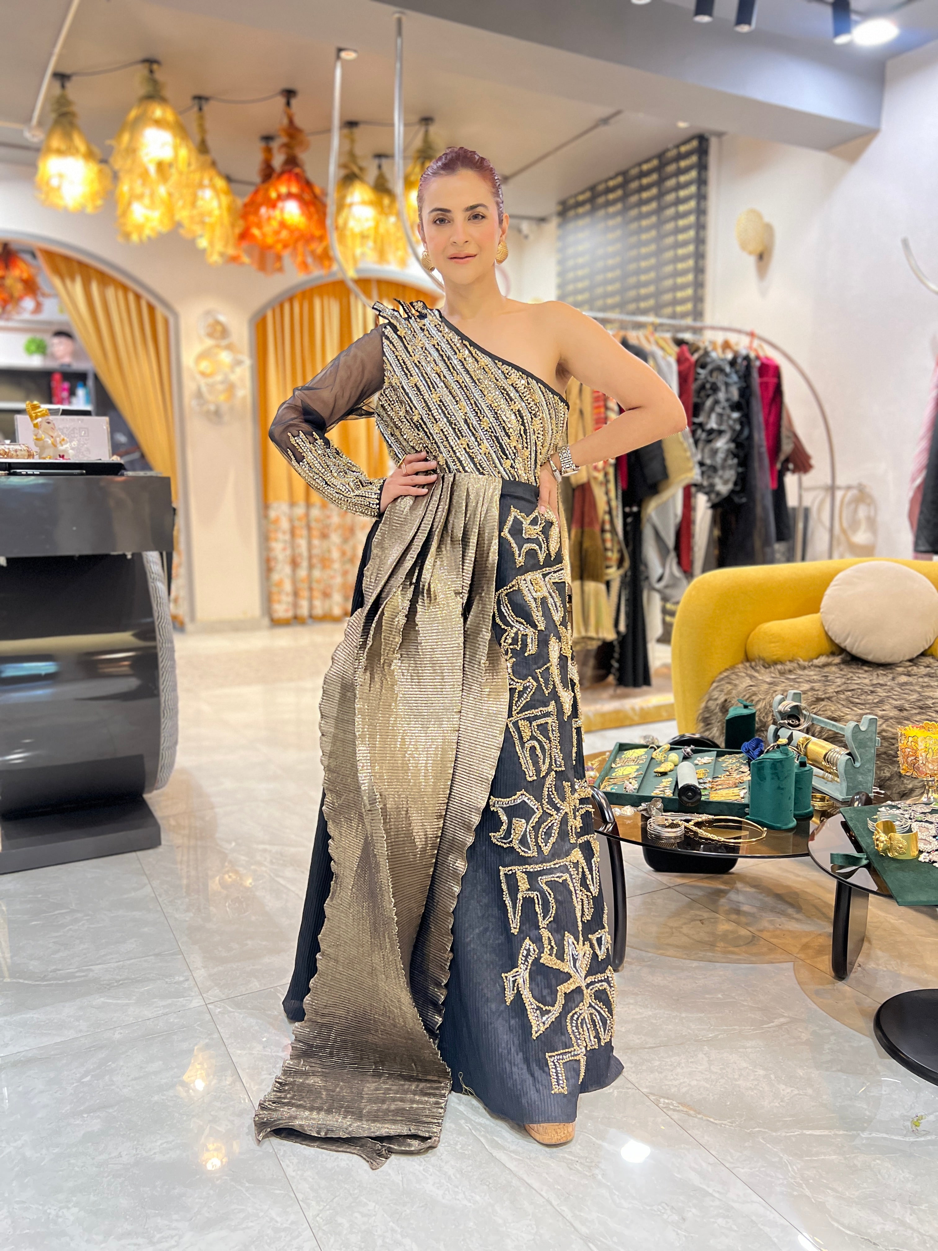 Off shoulder black embroidered gown with earrings