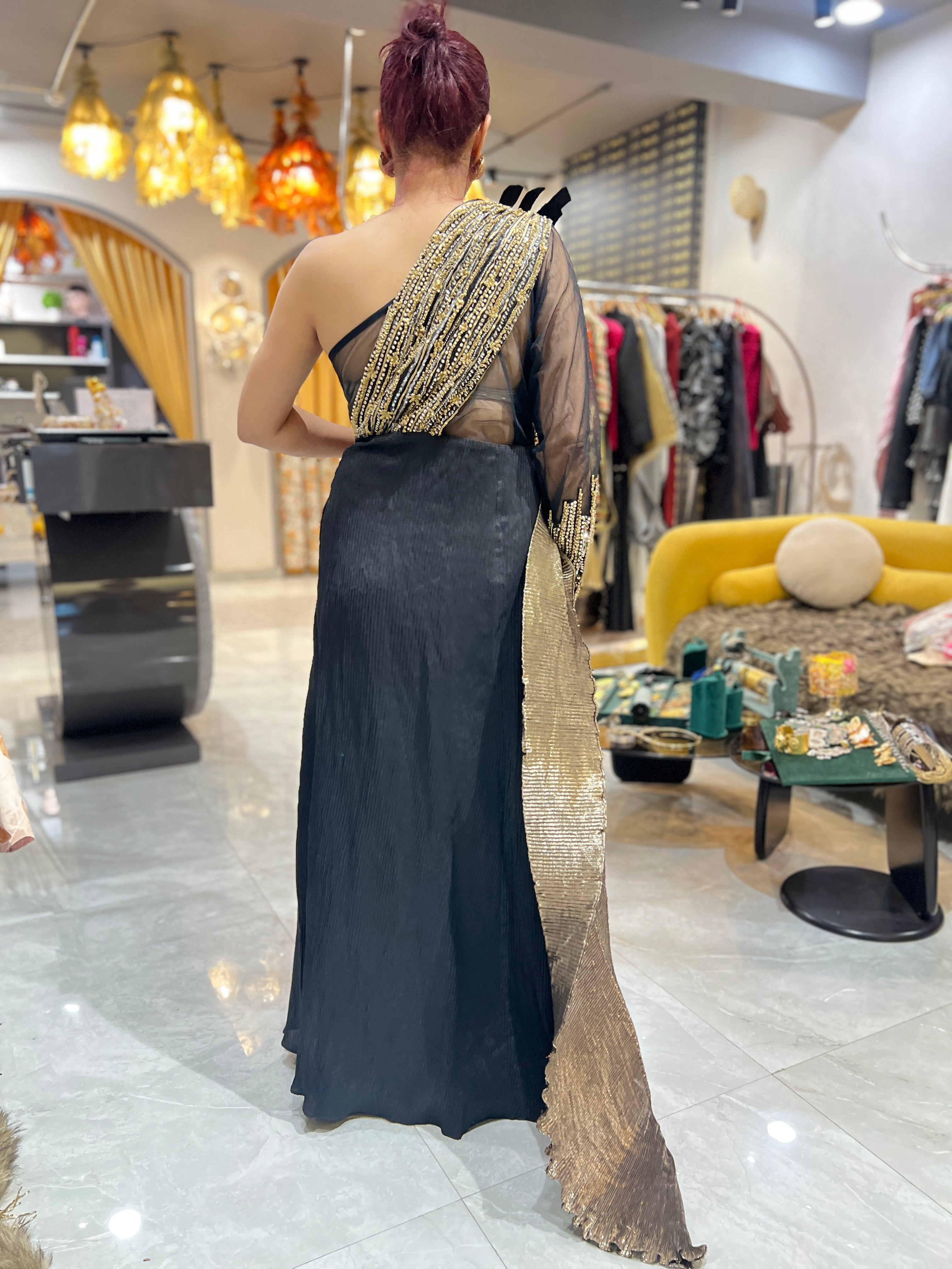 Off shoulder black embroidered gown with earrings