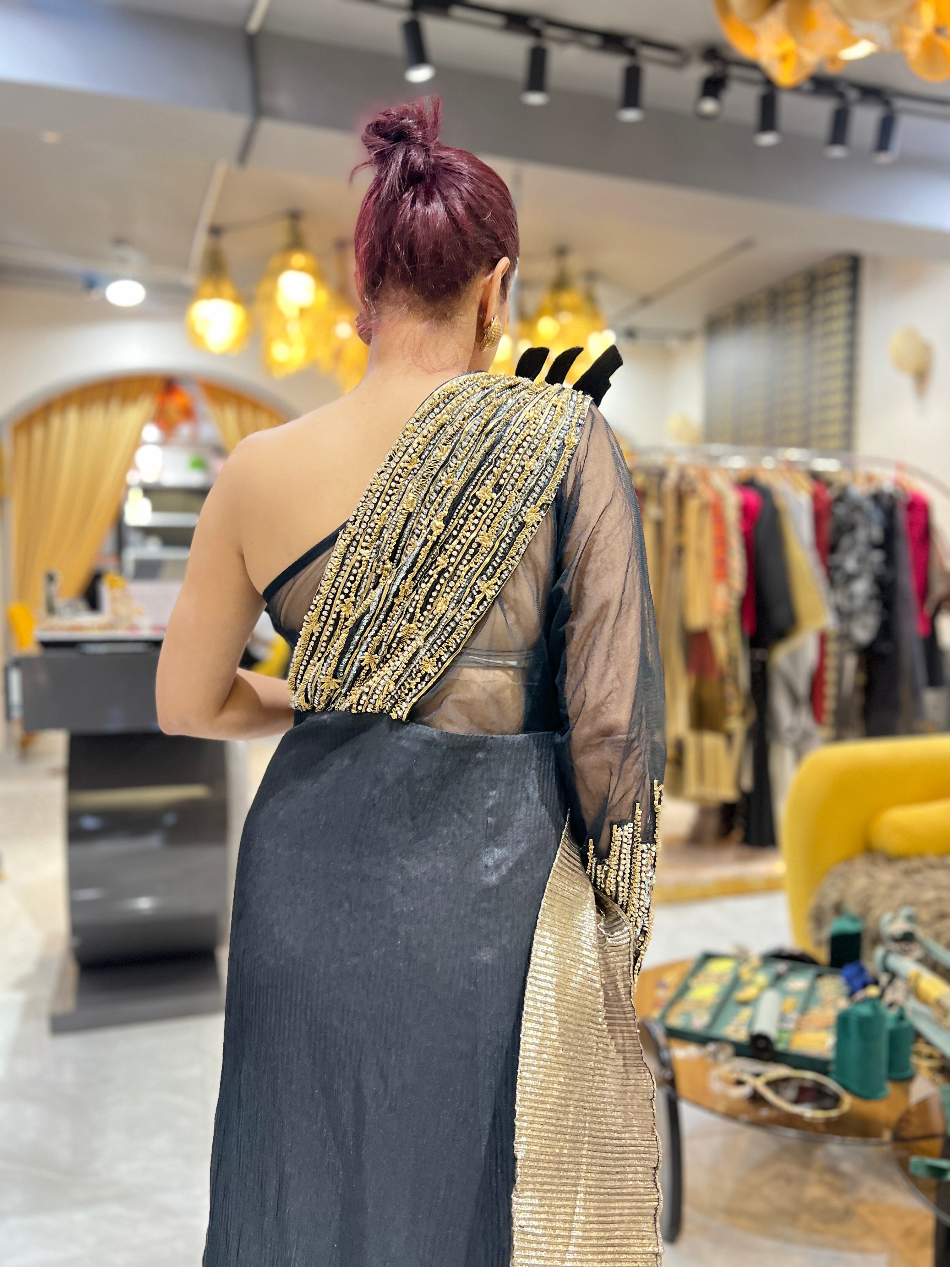 Off shoulder black embroidered gown with earrings