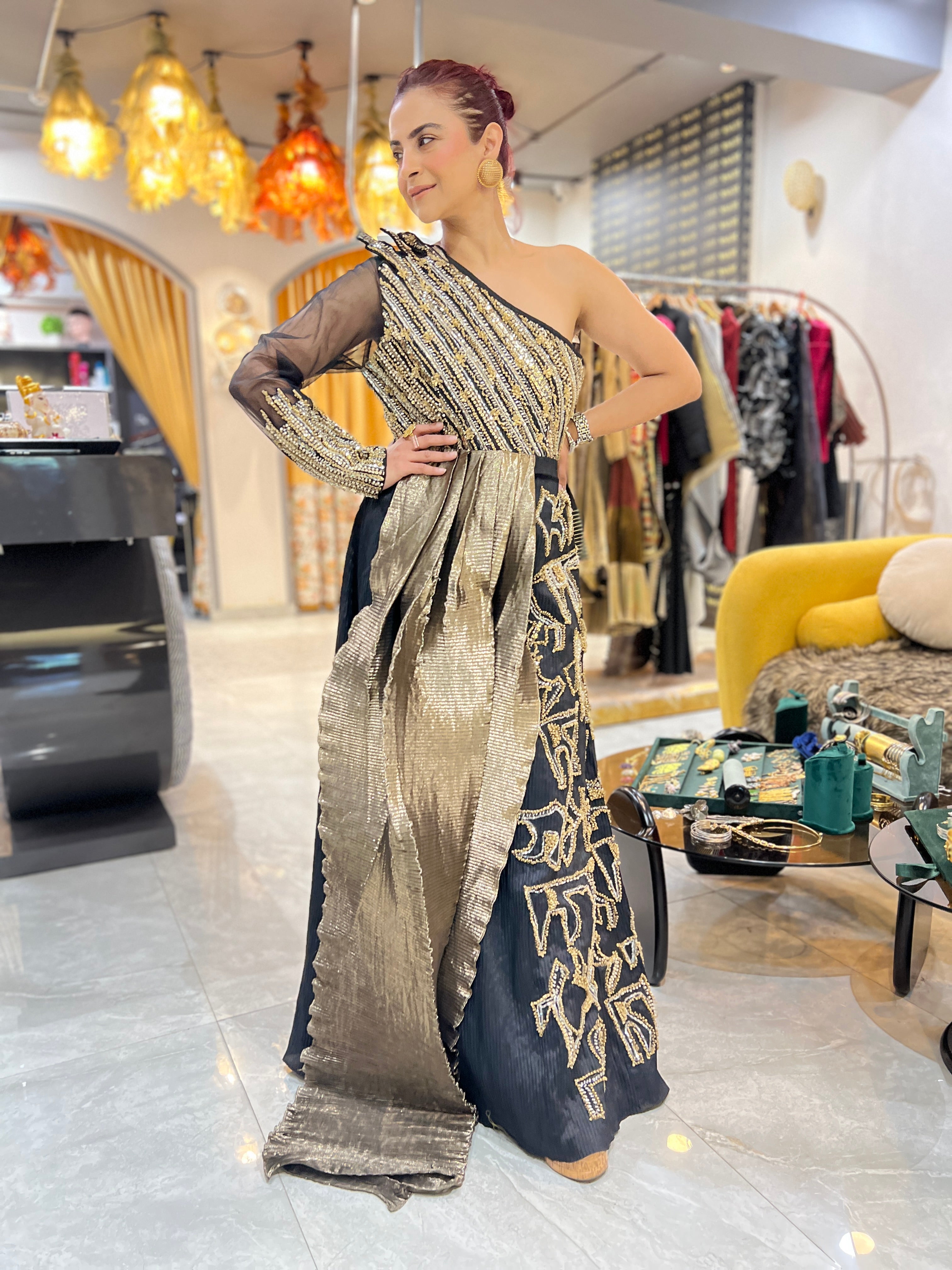 Off shoulder black embroidered gown with earrings