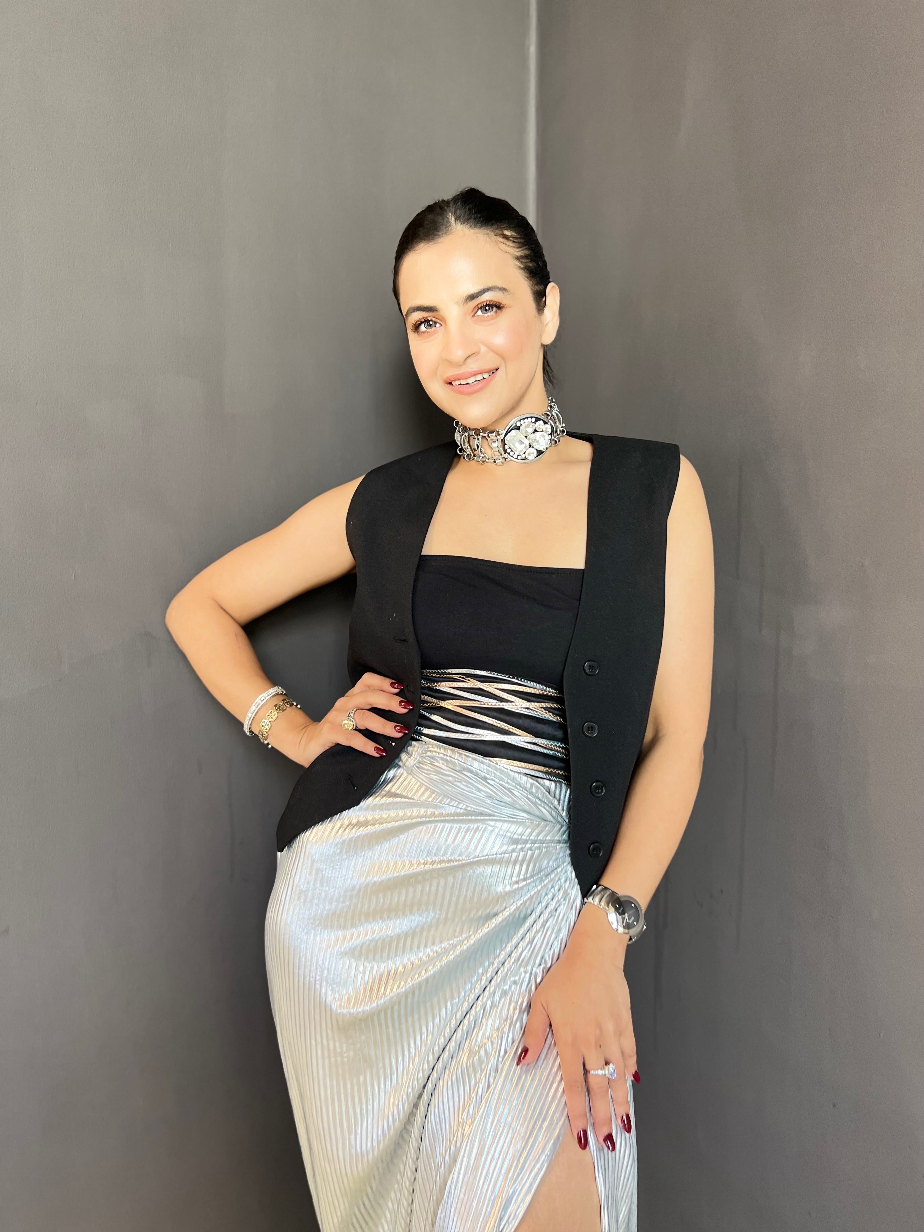 Waist coat with metallic drape skirt set in silver